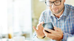 man looking at his smartphone